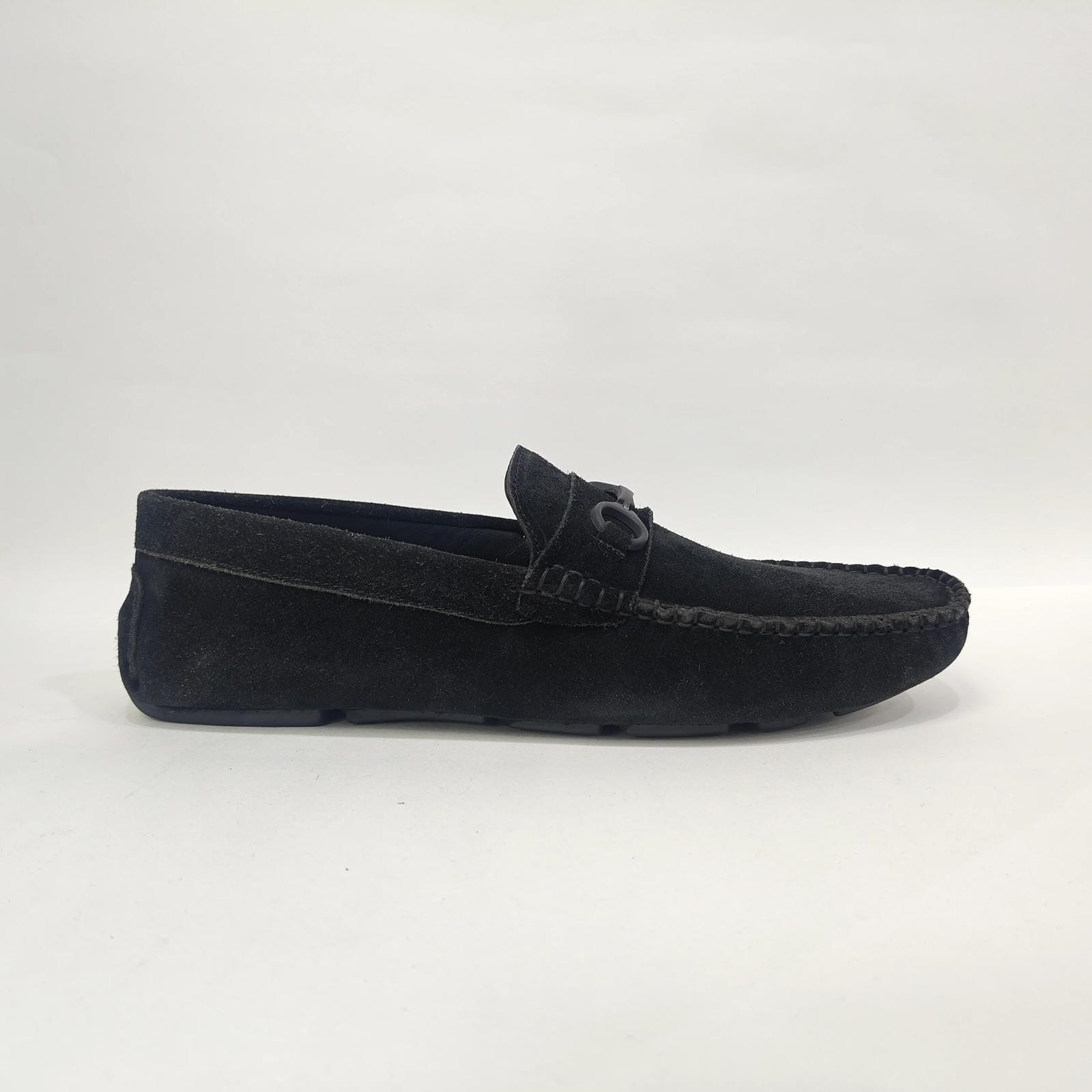 Men's leather shoes in black, showing a side view of the stylish medium ankle design.